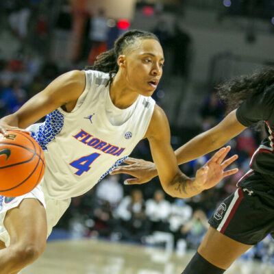 Florida guard Zippy Broughton (4) drives against South Carolina guard Bree Hall (23) during the first half of an NCAA college basketball game Sunday, Jan. 30, 2022, in Gainesville, Fla. (AP Photo/Alan Youngblood)